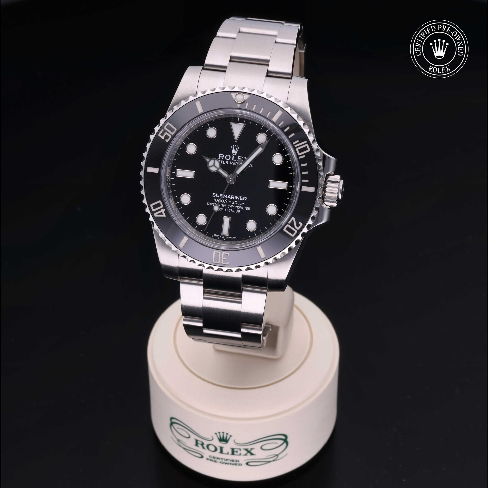 Rolex Submariner watch with steel Oyster bracelet and black dial on a white background.