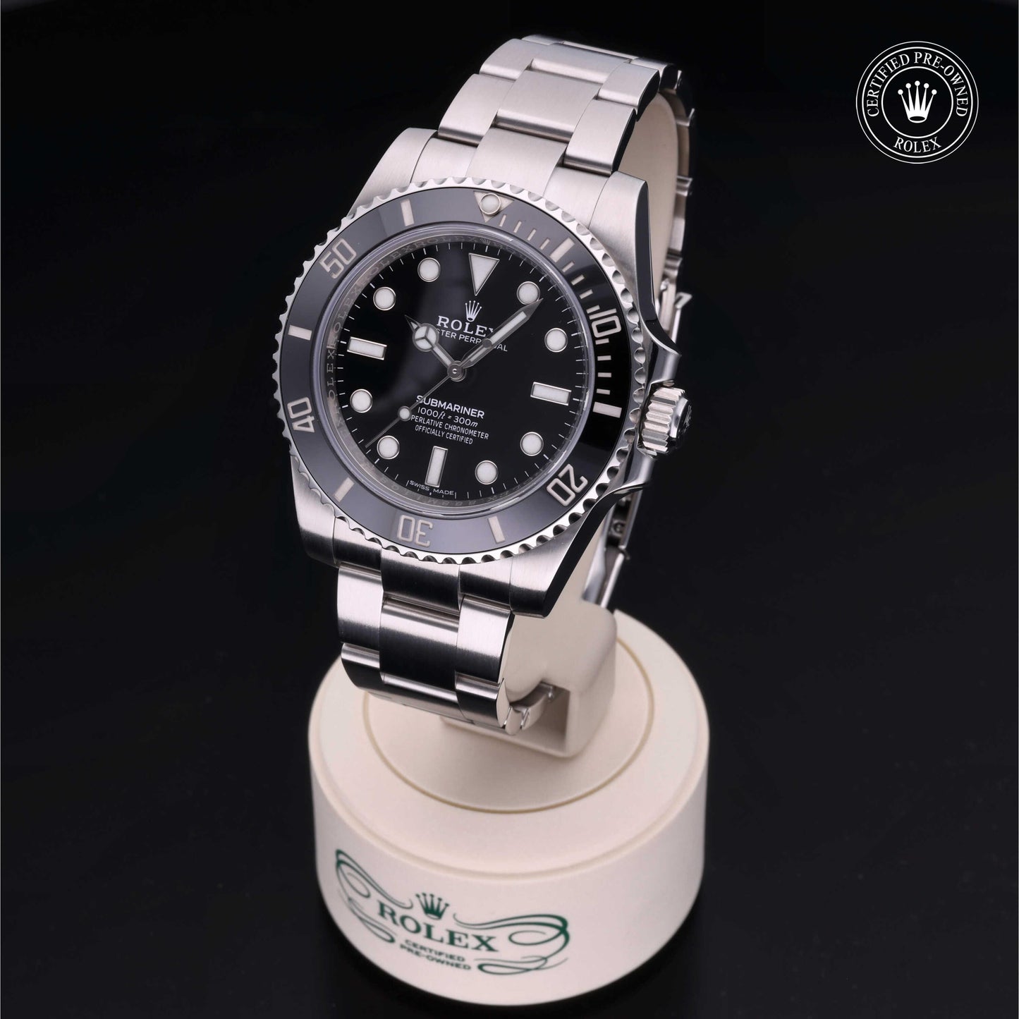 Rolex Submariner watch with steel Oyster bracelet and black dial on a white background.