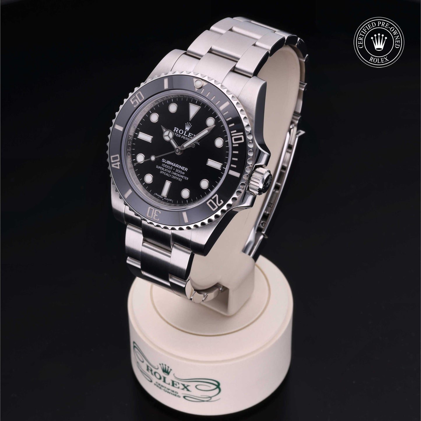 Rolex Submariner watch with steel Oyster bracelet and black dial on a white background.