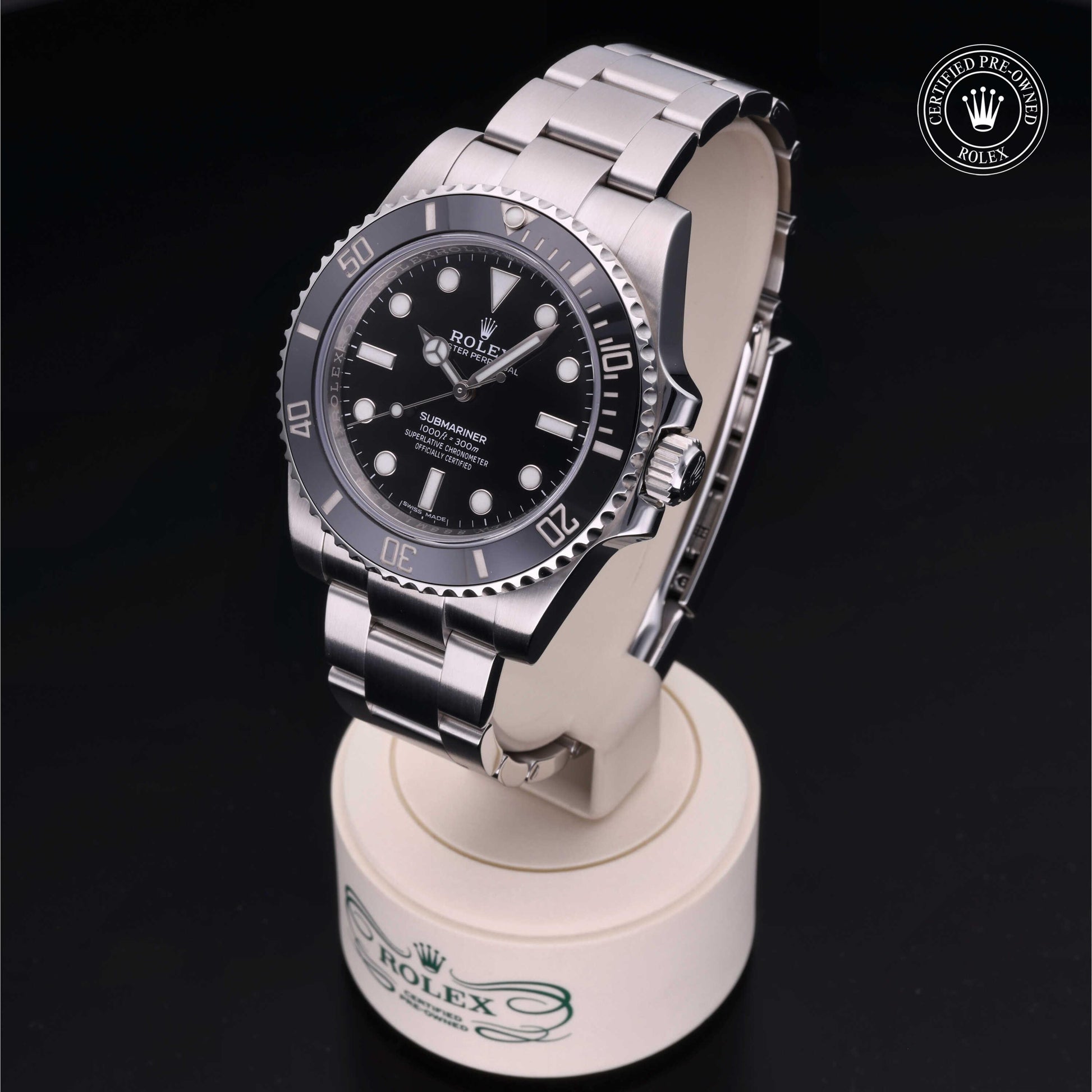 Rolex Submariner watch with steel Oyster bracelet and black dial on a white background.