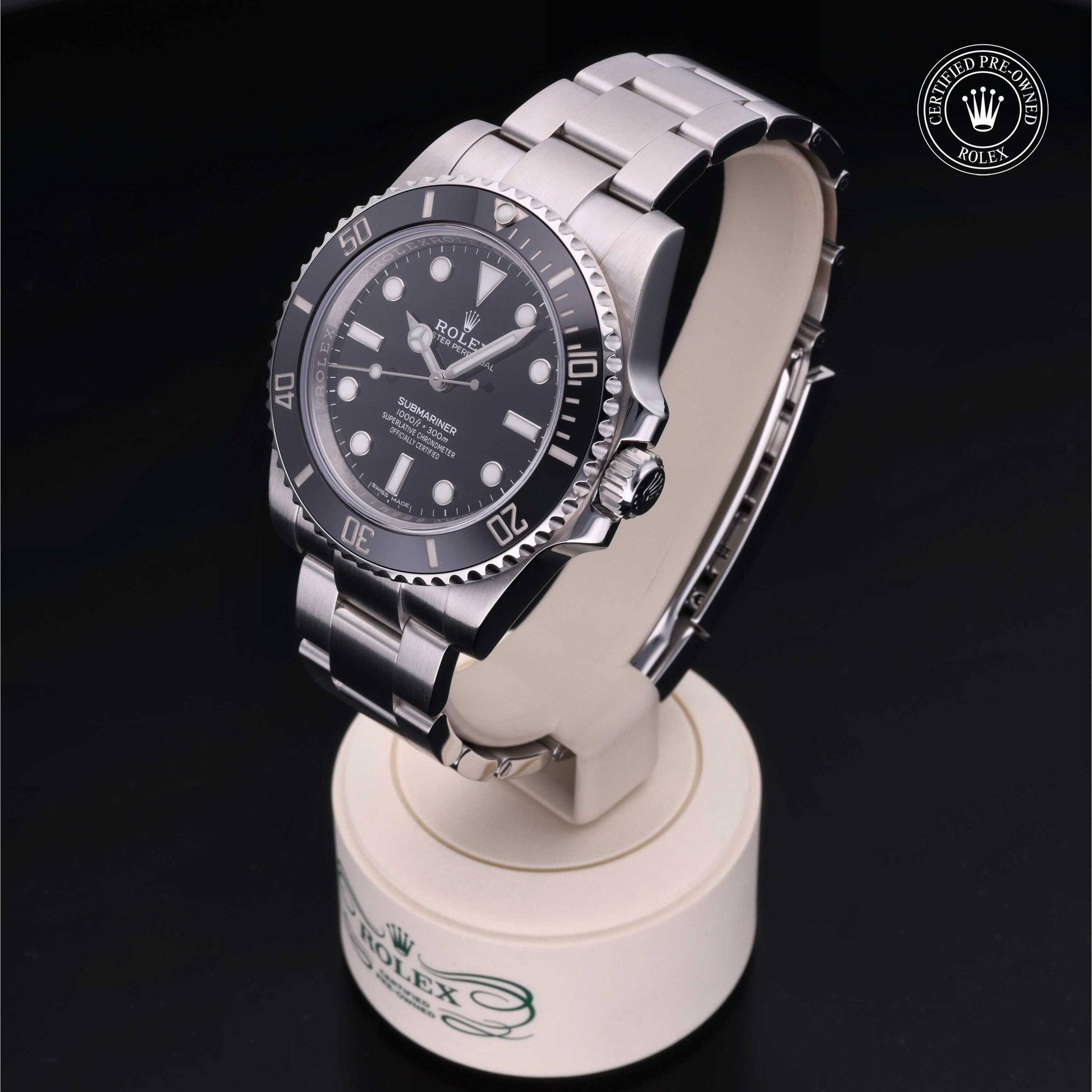Rolex Submariner watch with steel Oyster bracelet and black dial on a white background.