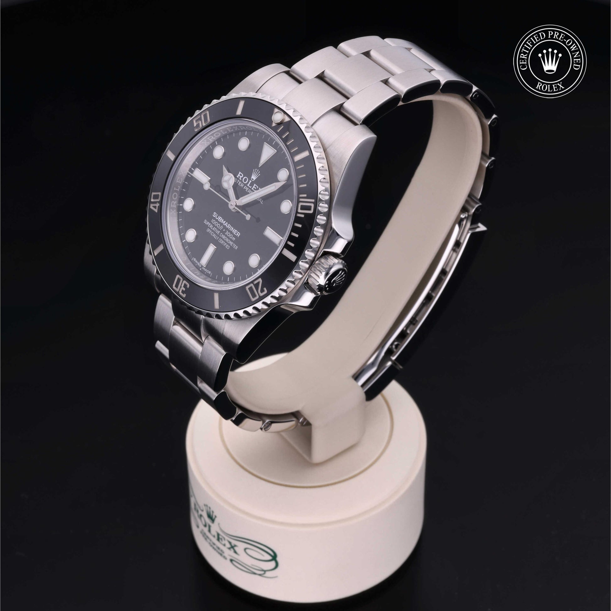 Rolex Submariner watch with steel Oyster bracelet and black dial on a white background.