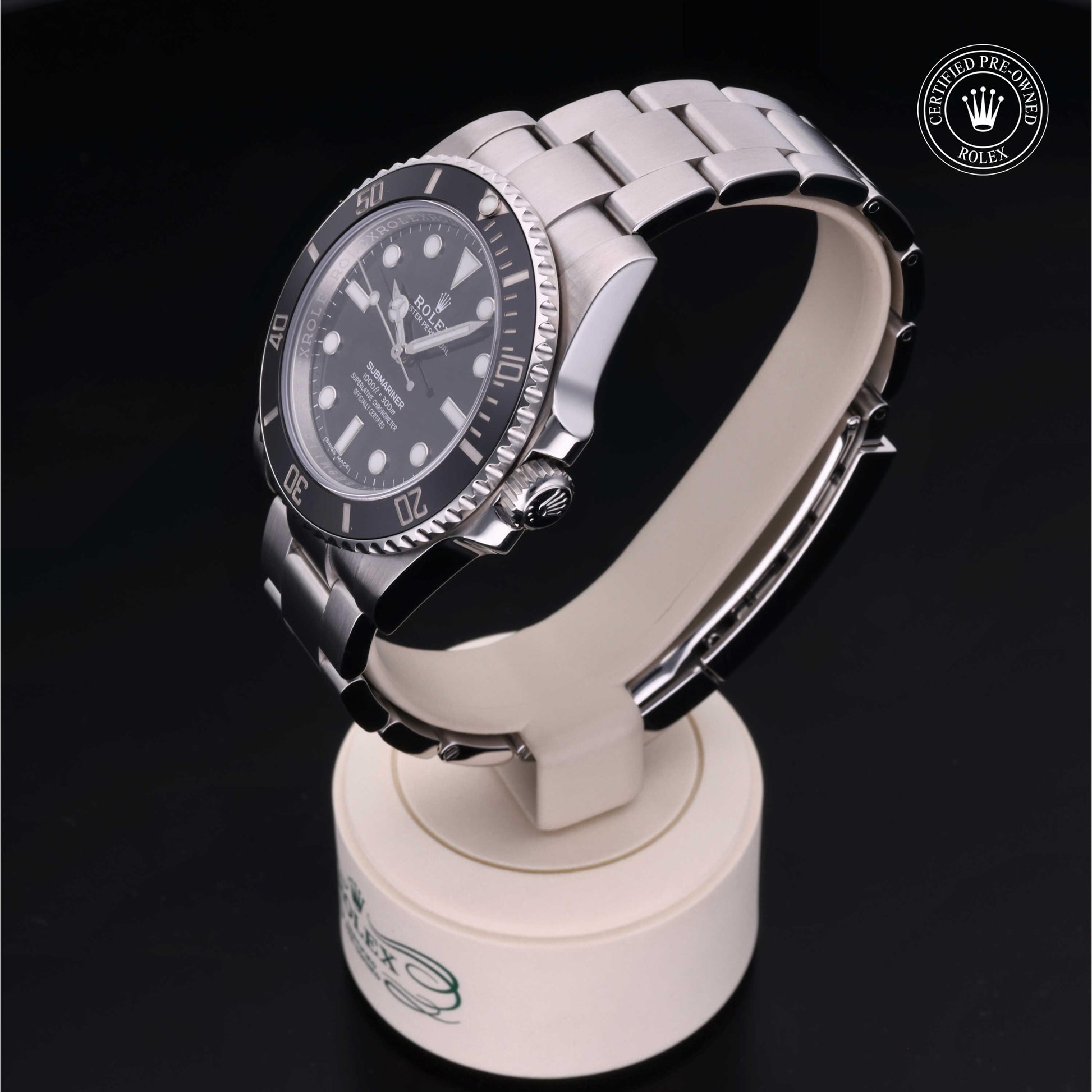 Rolex Submariner watch with steel Oyster bracelet and black dial on a white background.