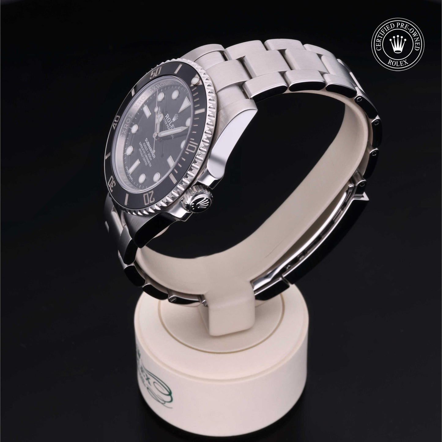 Rolex Submariner watch with steel Oyster bracelet and black dial on a white background.