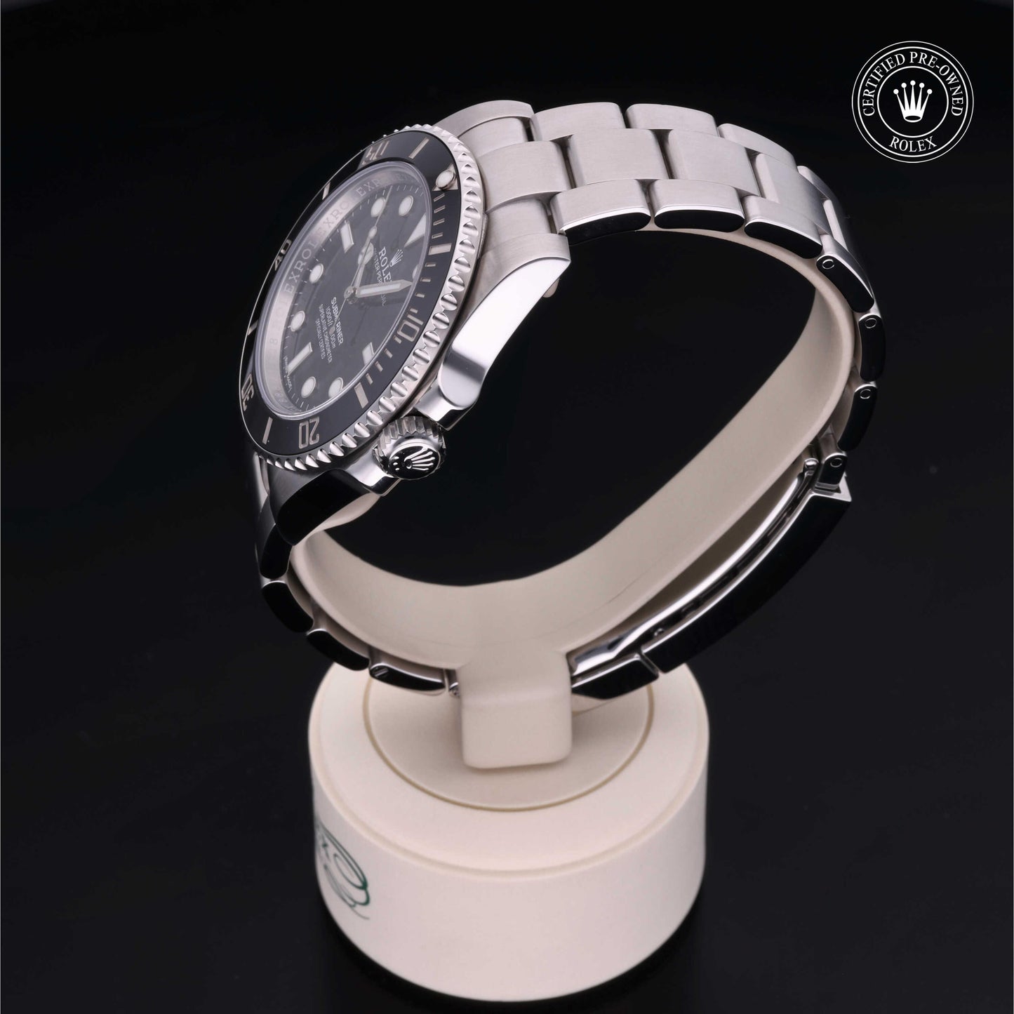 Rolex Submariner watch with steel Oyster bracelet and black dial on a white background.