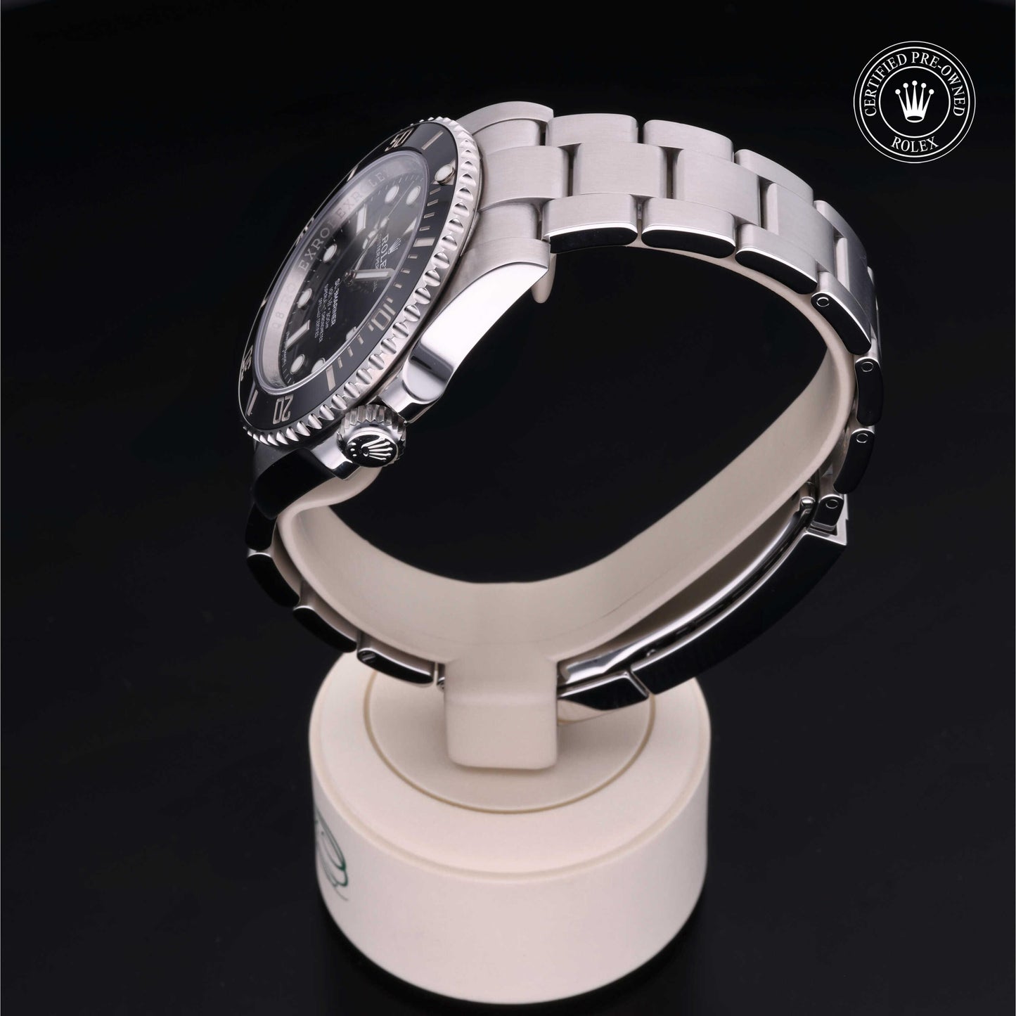 Rolex Submariner watch with steel Oyster bracelet and black dial on a white background.