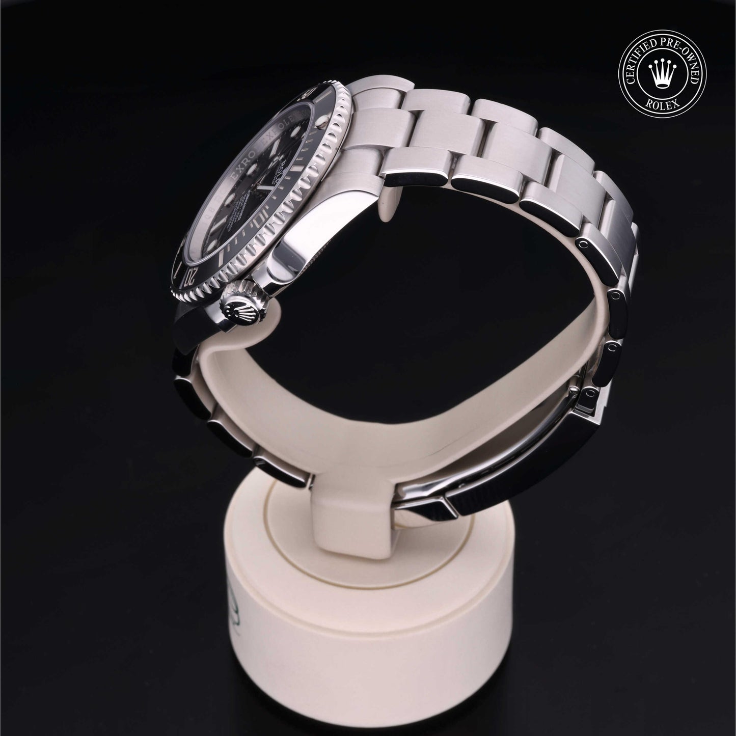 Rolex Submariner watch with steel Oyster bracelet and black dial on a white background.