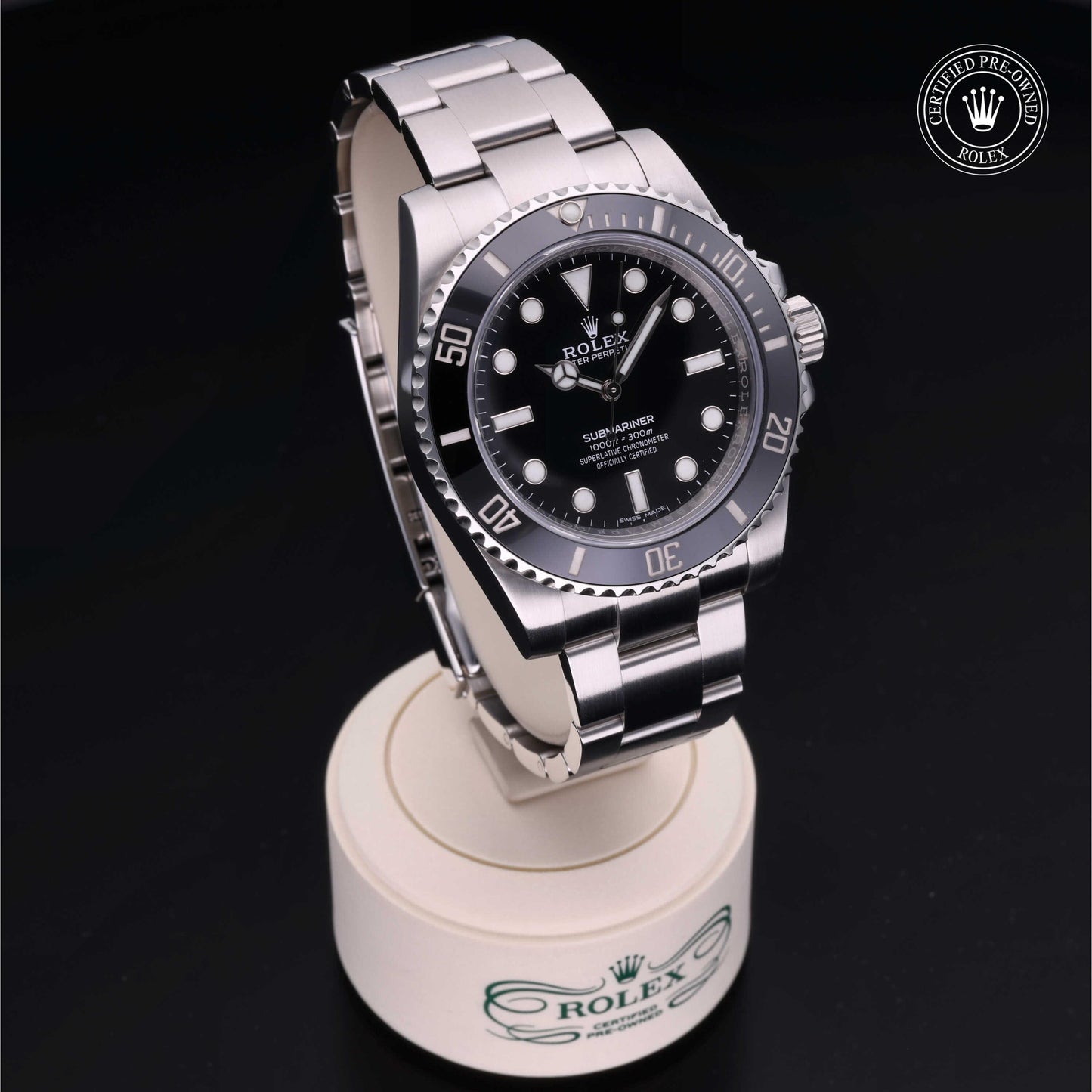 Rolex Submariner watch with steel Oyster bracelet and black dial on a white background.