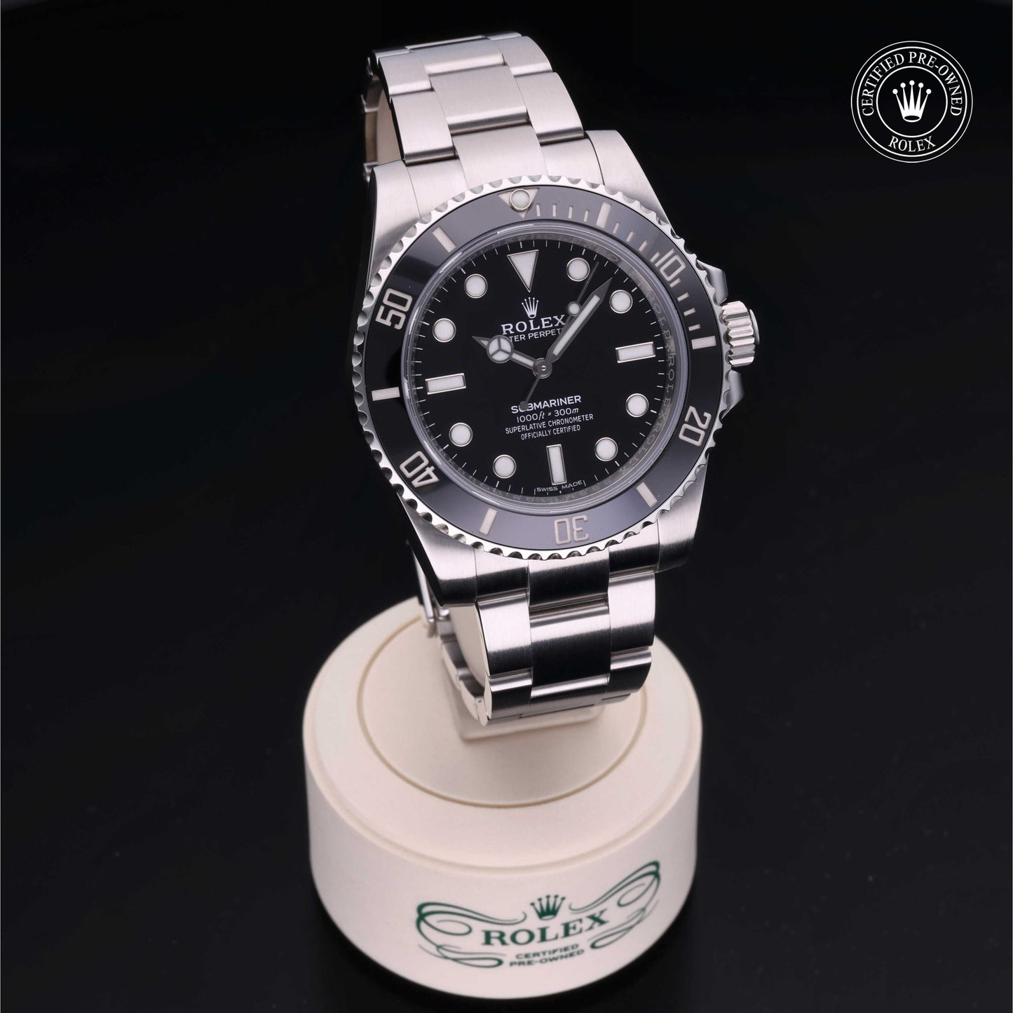 Rolex Submariner watch with steel Oyster bracelet and black dial on a white background.