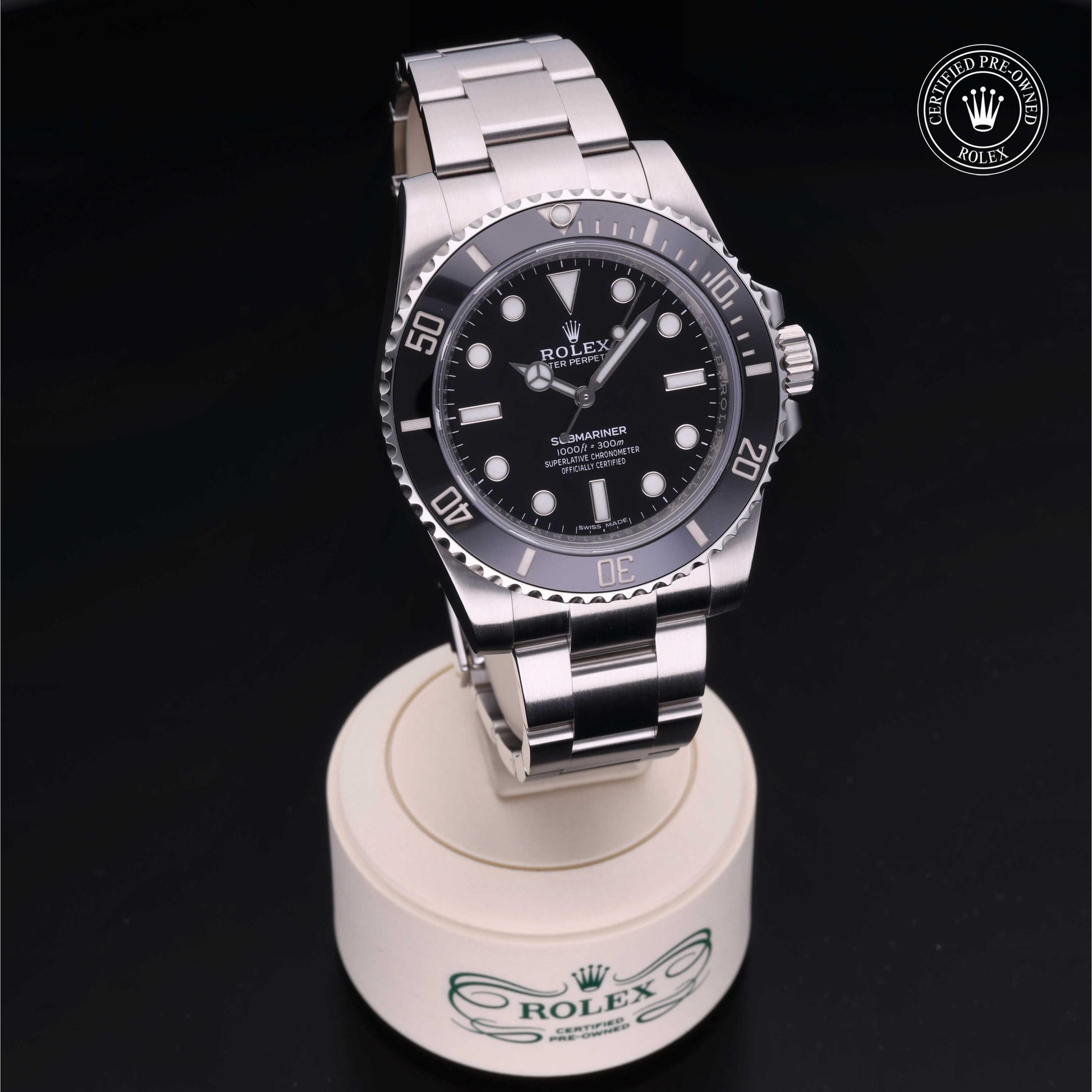 Rolex Submariner watch with steel Oyster bracelet and black dial on a white background.
