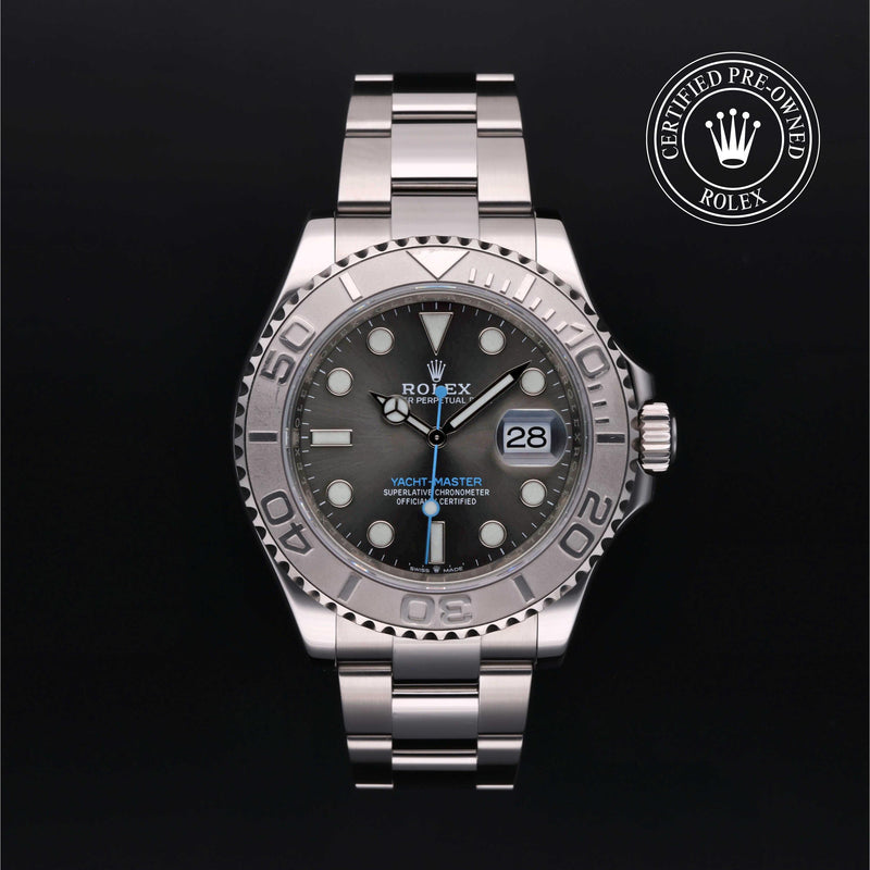 Rolex Yacht-Master watch with a steel Oyster bracelet and slate dial on a black background.