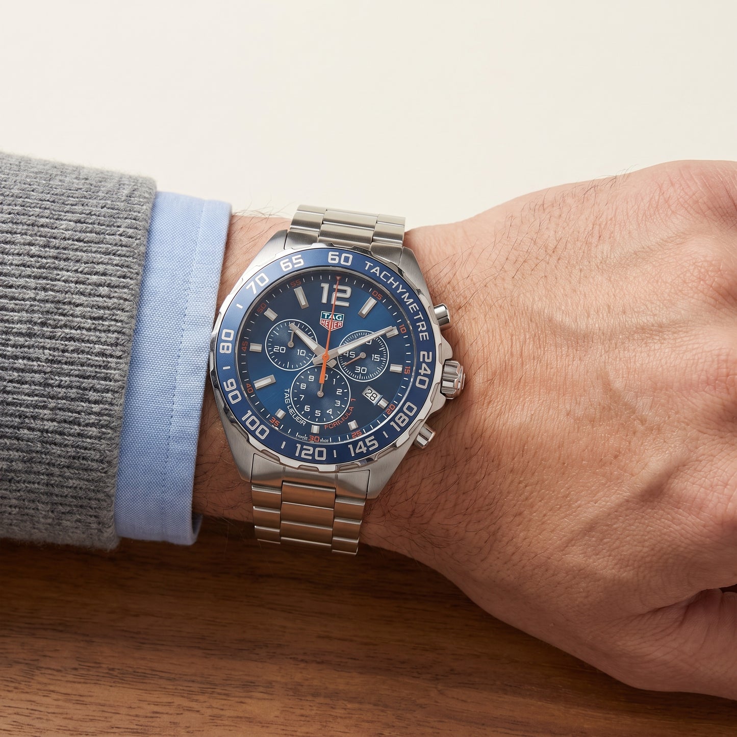 TAG Heuer Formula 1 Chronograph with steel bracelet and blue dial on a gents wrist.