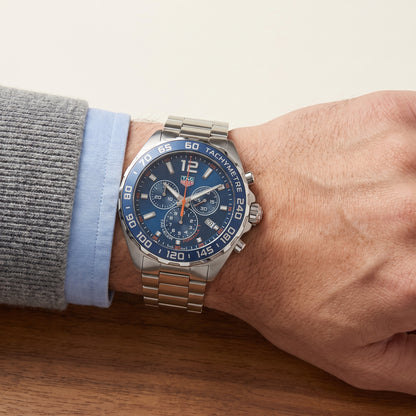 TAG Heuer Formula 1 Chronograph with steel bracelet and blue dial on a gents wrist.