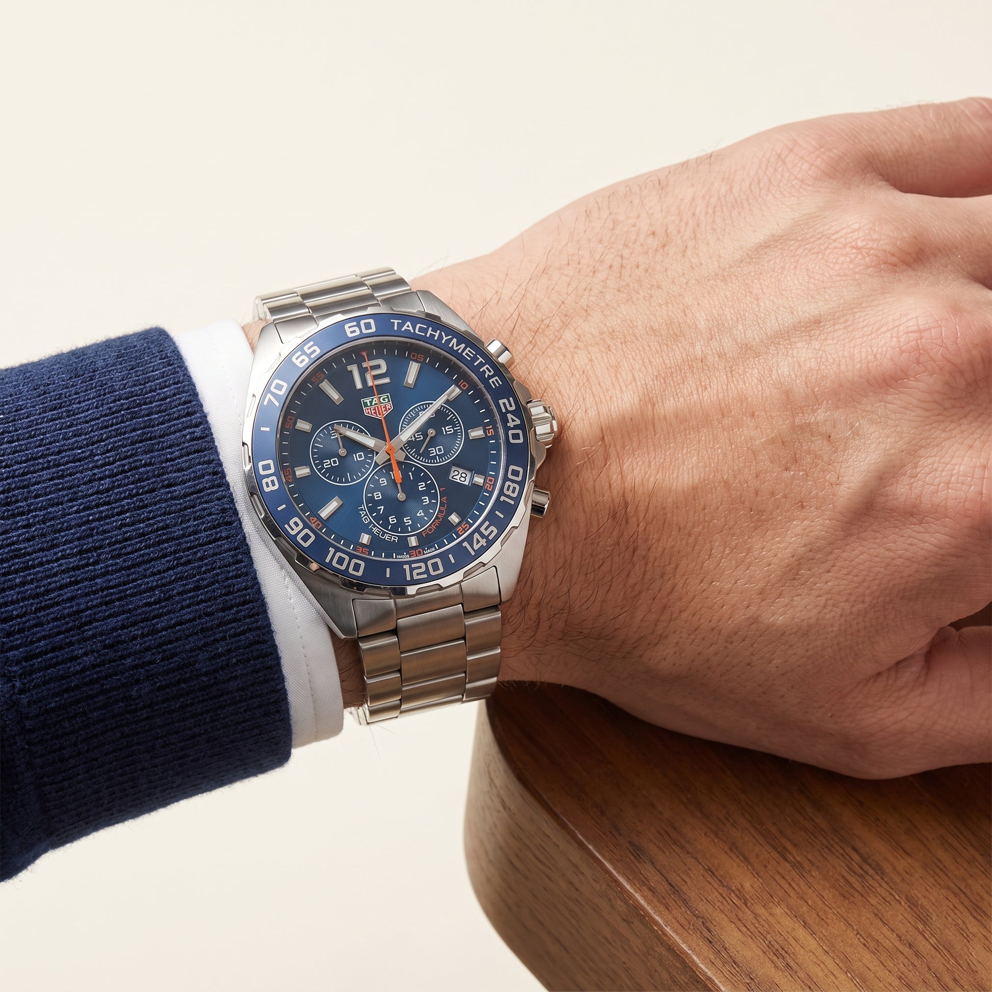 TAG Heuer Formula 1 Chronograph with steel bracelet and blue dial on a gents wrist.
