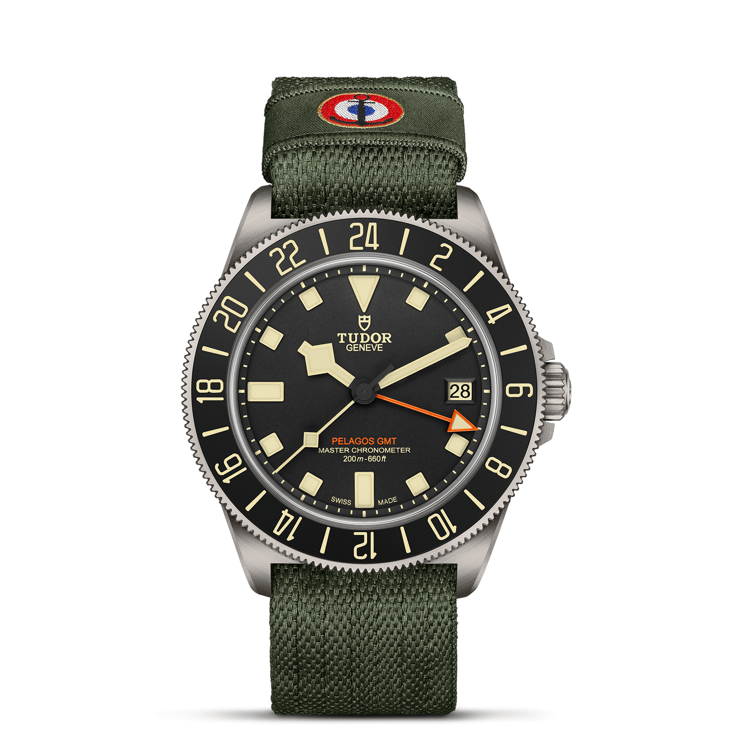 TUDOR Pelagos FXD GMT with 42mm titanium case, green fabric strap and black dial on a white background.