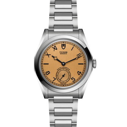 Tudor Monarch watch with steel bracelet and champagne dial on a white background.