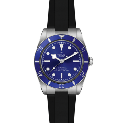 Tudor Black Bay 54 watch with a black rubber strap and blue dial on a white background.