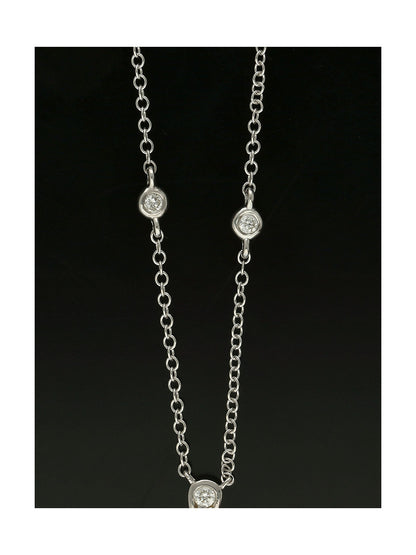 Blue Topaz & Diamond Pear Drop Pendant in 9ct White Gold on 18" Chain