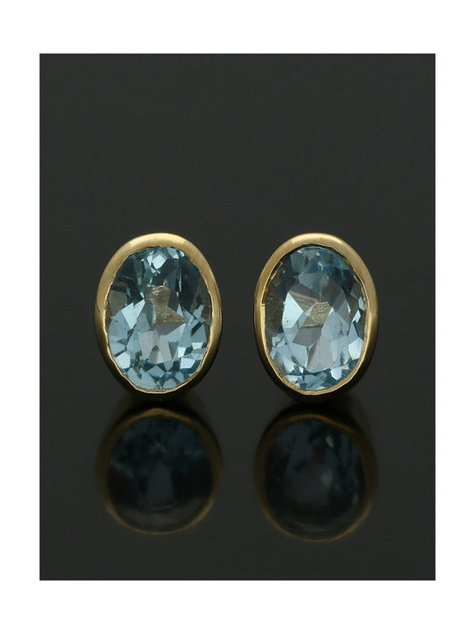 Oval Blue Topaz Stud Earrings 8x6mm in 9ct Yellow Gold