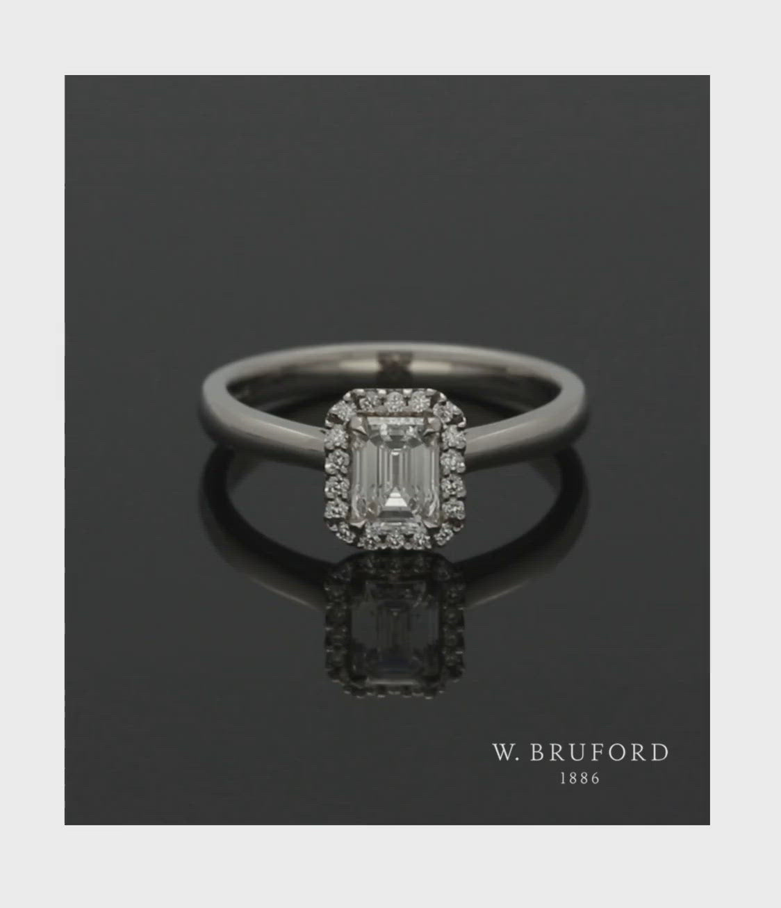 Diamond Halo Engagement Ring 0.70ct Certificated Emerald Cut in Platinum