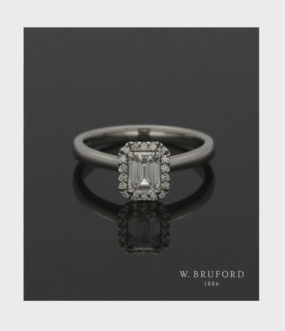 Diamond Halo Engagement Ring 0.70ct Certificated Emerald Cut in Platinum