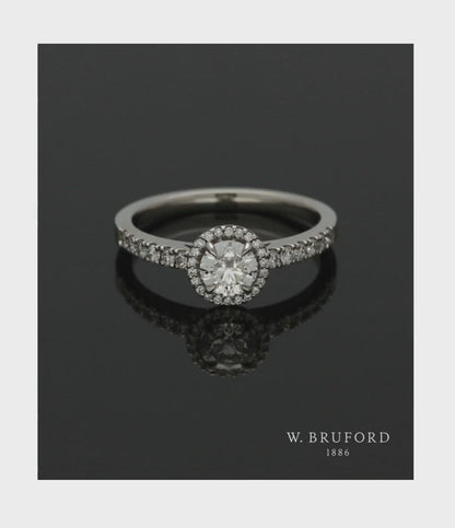 Diamond Halo Engagement Ring 0.50ct Certificated Round Brilliant Cut in Platinum with Diamond Shoulders