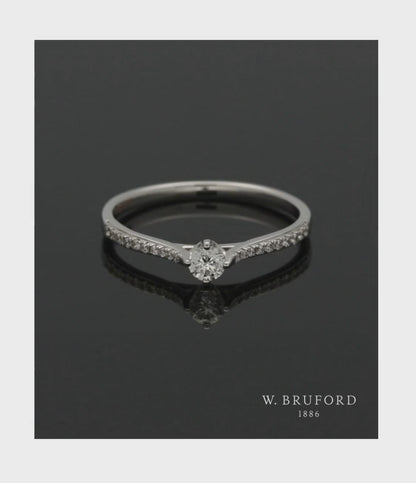  Diamond Solitaire Ring 0.15ct Round Brilliant Cut in 18ct White Gold with Diamond Shoulders